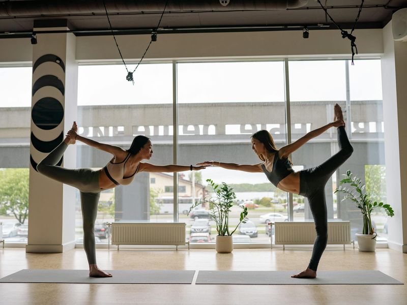 Wide view of a modern dark yoga studio interior